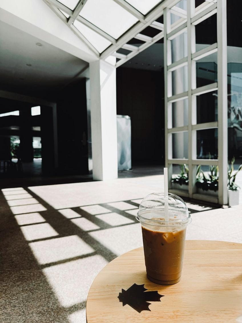 interior of a trendy Dutch coffee shop with modern decor and sustainable branding