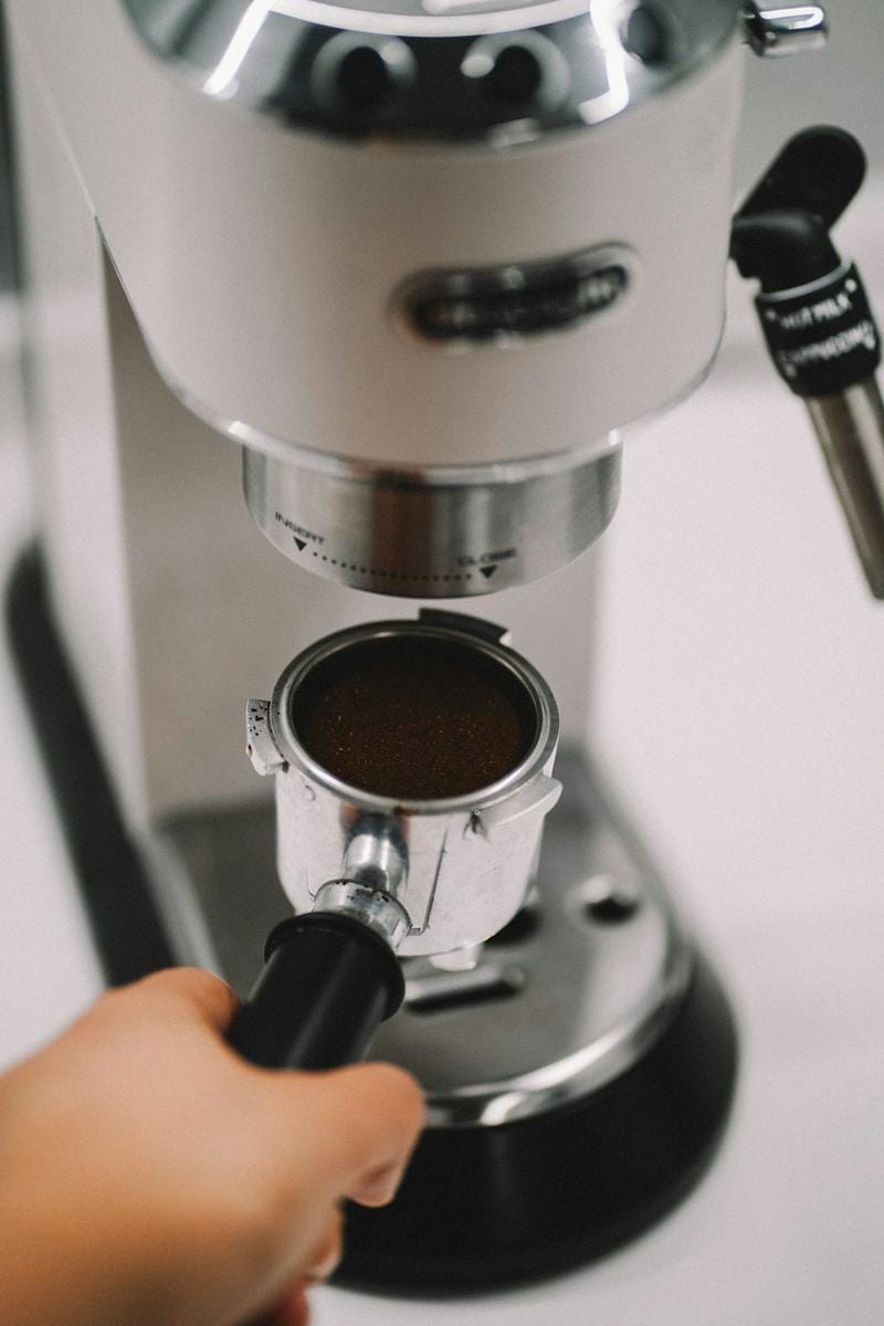 Close-up of a barista expertly preparing an espresso shot with a professional espresso machine