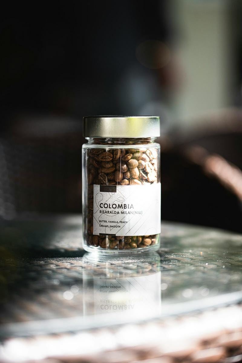 A stylish home coffee setup with a manual grinder, pour-over station, and beautifully arranged cups