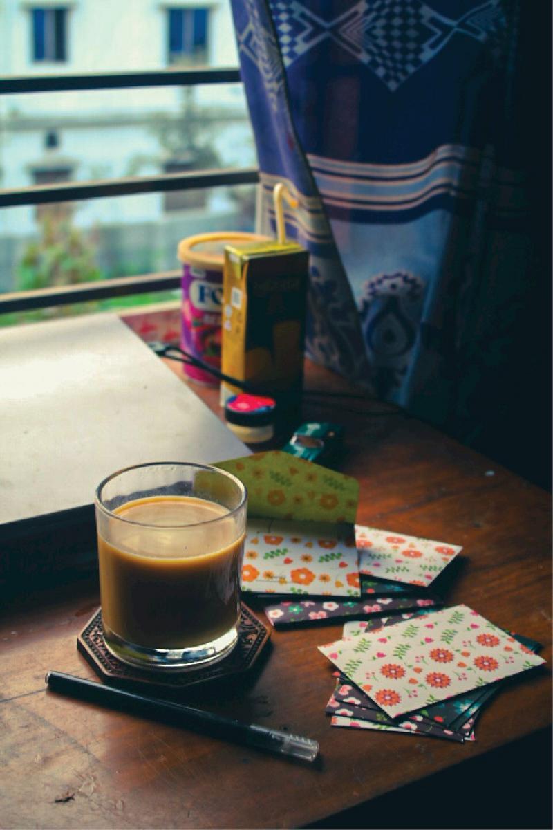 Close-up of a pour-over coffee being prepared with a V60 dripper in a cozy Dutch kitchen setting.