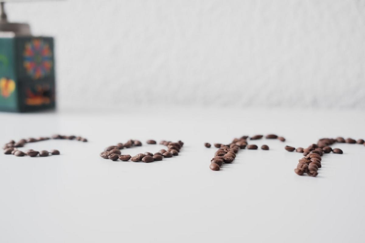 close-up of a pour-over coffee setup with a manual drip cone, hot water pouring over coffee grounds